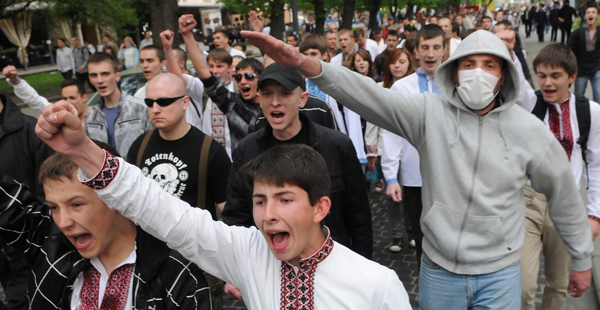 Ukrainian youth in "vyshivankas" throwint Nazi salutes