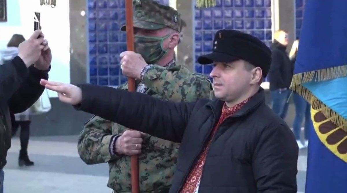 Member of an Ukrainian far right group throwing a Nazi salute