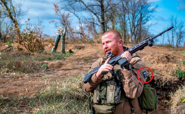 Ukrainian soldier with a Nazi eagle chevron