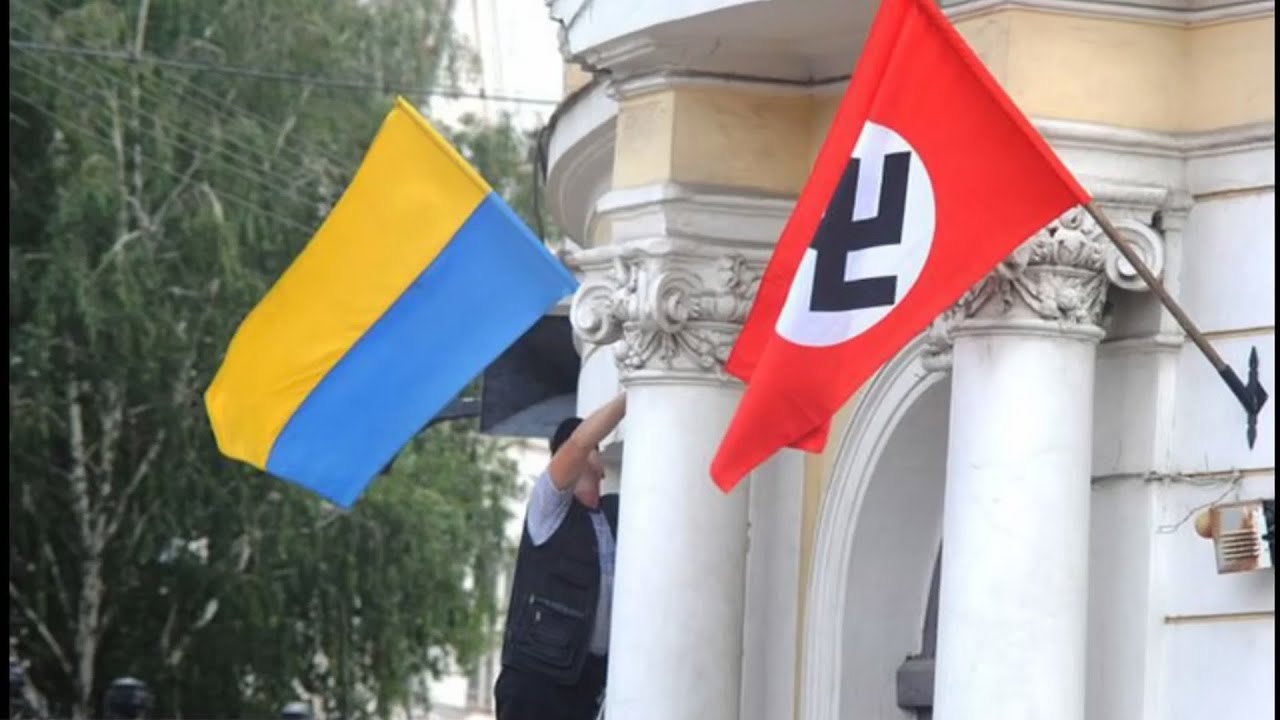 Ukrainian flag and Nazi banner on an official building in Ukraine