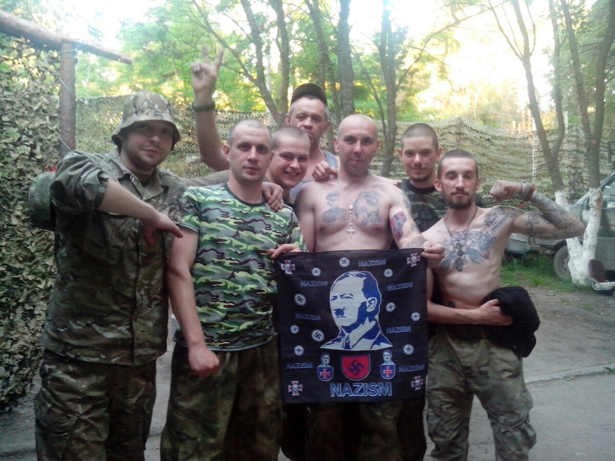 Another group of Ukrainian Nazi soldiers wit ha portrait of Adolf Hitler