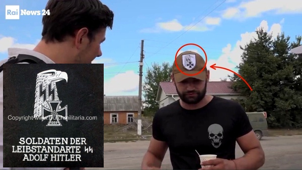 A screenshot from an Italian TV report in which a reporter is interviewing an Ukrainian soldier who wears a cap with Nazi symbols