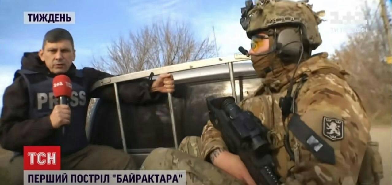 Ukrainian TV reporter interviews a soldier wearing the patch of the SS "Galicia" division on his sleeve.