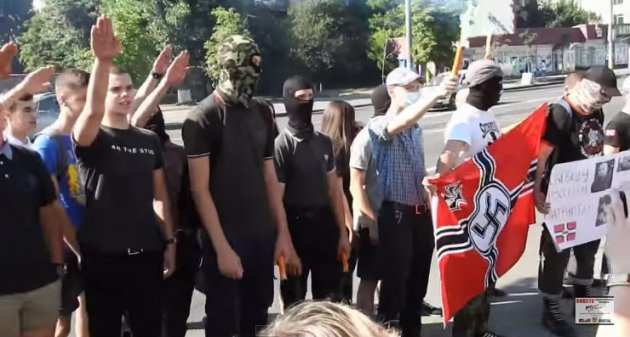 Group of Ukrainian Nazi with a Third Reich banner